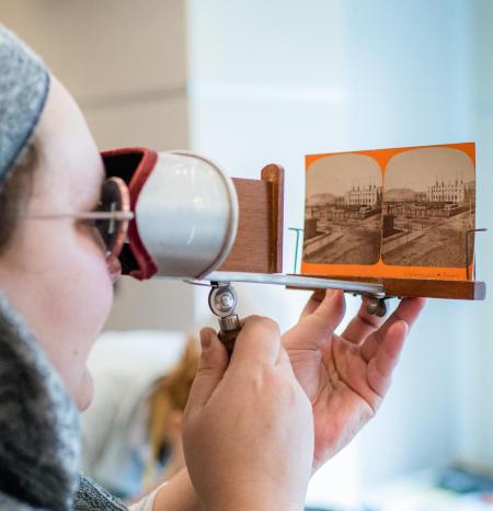 student looking at a stereograph